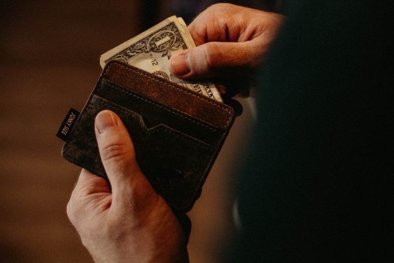 person holding wallet
