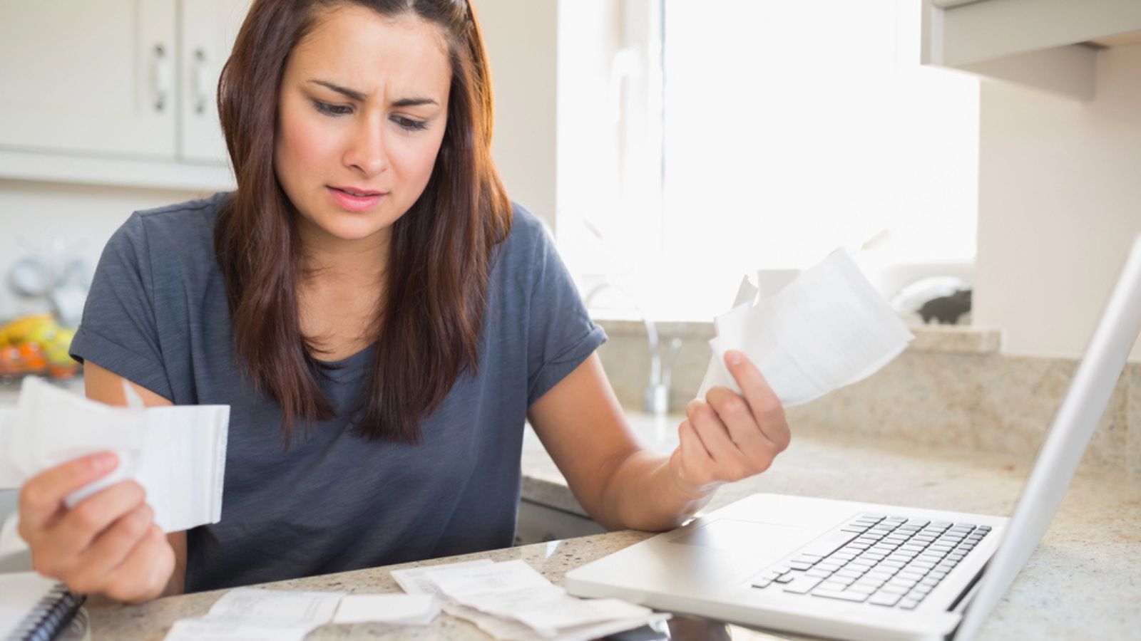 woman getting stressed over finances