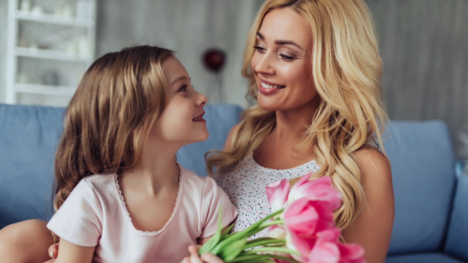 Attractive young woman with little girl are spending time together. Mother and daughter. Family Concept