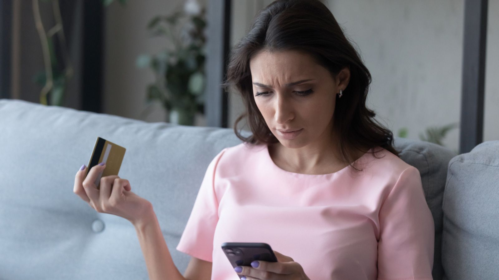 Unhappy worried upset woman finances budget credit card