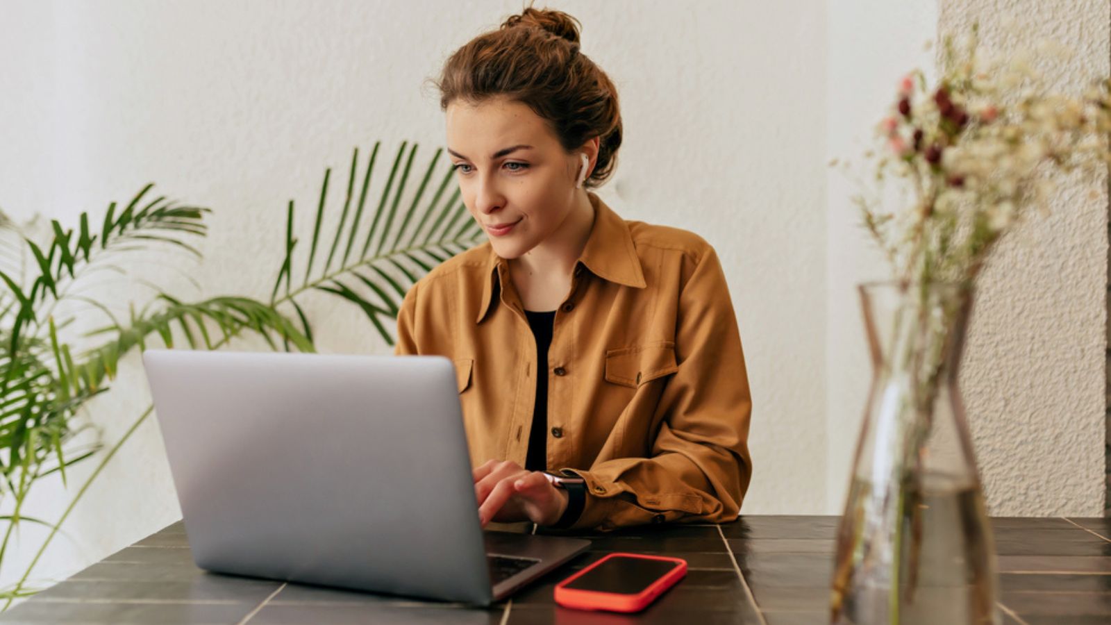 Woman working in the table with her laptop. Work Concept