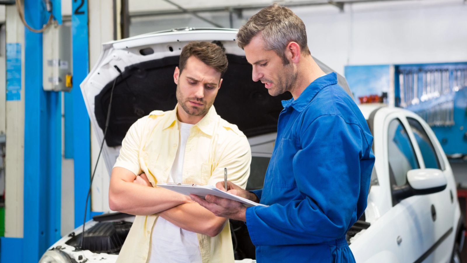 Customer listening to his mechanic