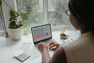 a person working on the laptop; single income budget