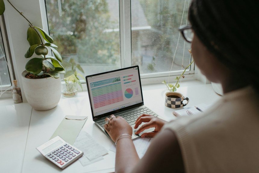 a person working on the laptop; single income budget