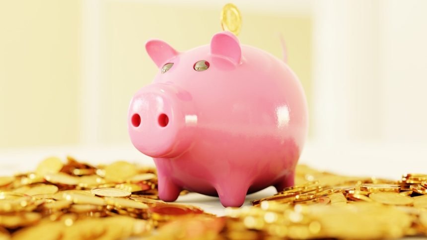 pink pig coin bank on brown wooden table; sinking fund