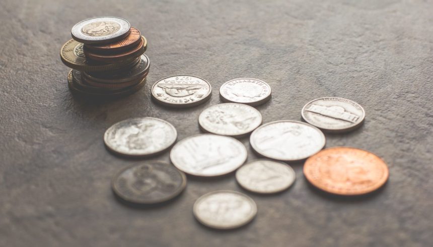 coins on gray surface; student loan wage garnishment; student loan wage garnishment