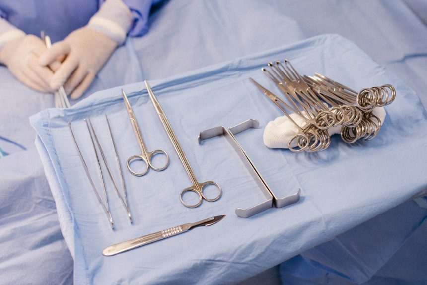 A hospital bed with surgical equipment on top of it; bariatric surgery