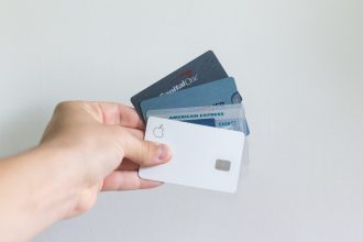 white and blue magnetic card; credit card delinquency
