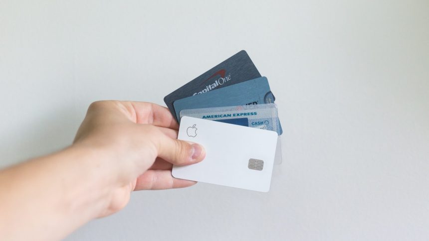 white and blue magnetic card; credit card delinquency
