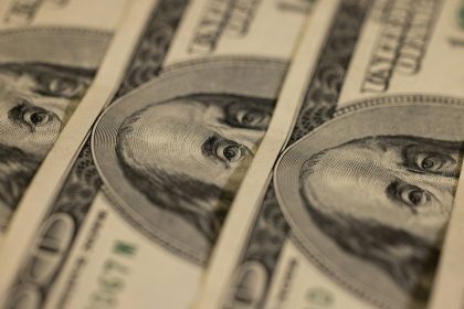 a close up of a bunch of money; The Fed