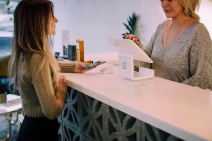woman standing near monitor; buy now pay later credit report