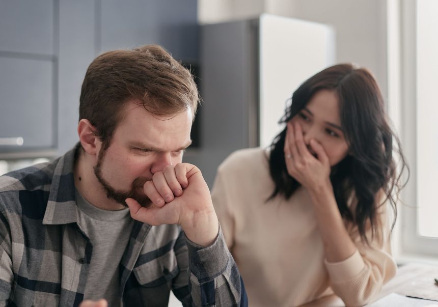 Anxious couple talking seriously about financial regret and debt in 2026